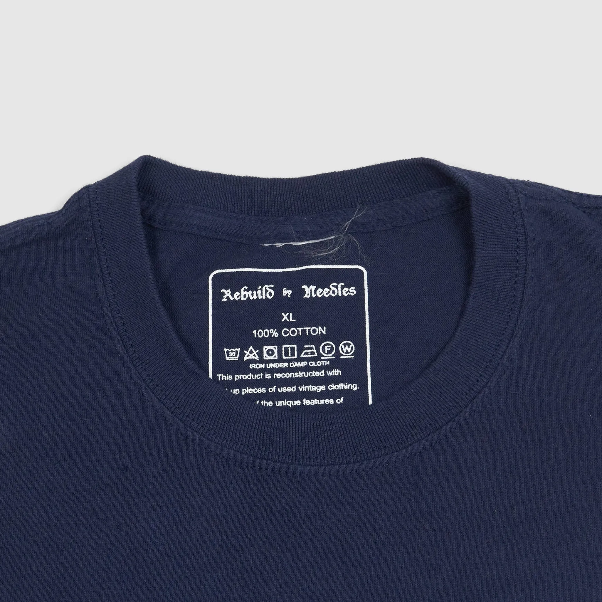 Needles Rebuild 7-Cuts T-Shirt